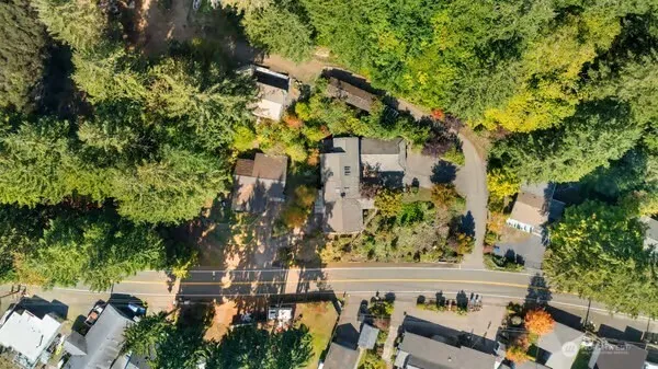 an aerial view of a residential houses with outdoor space