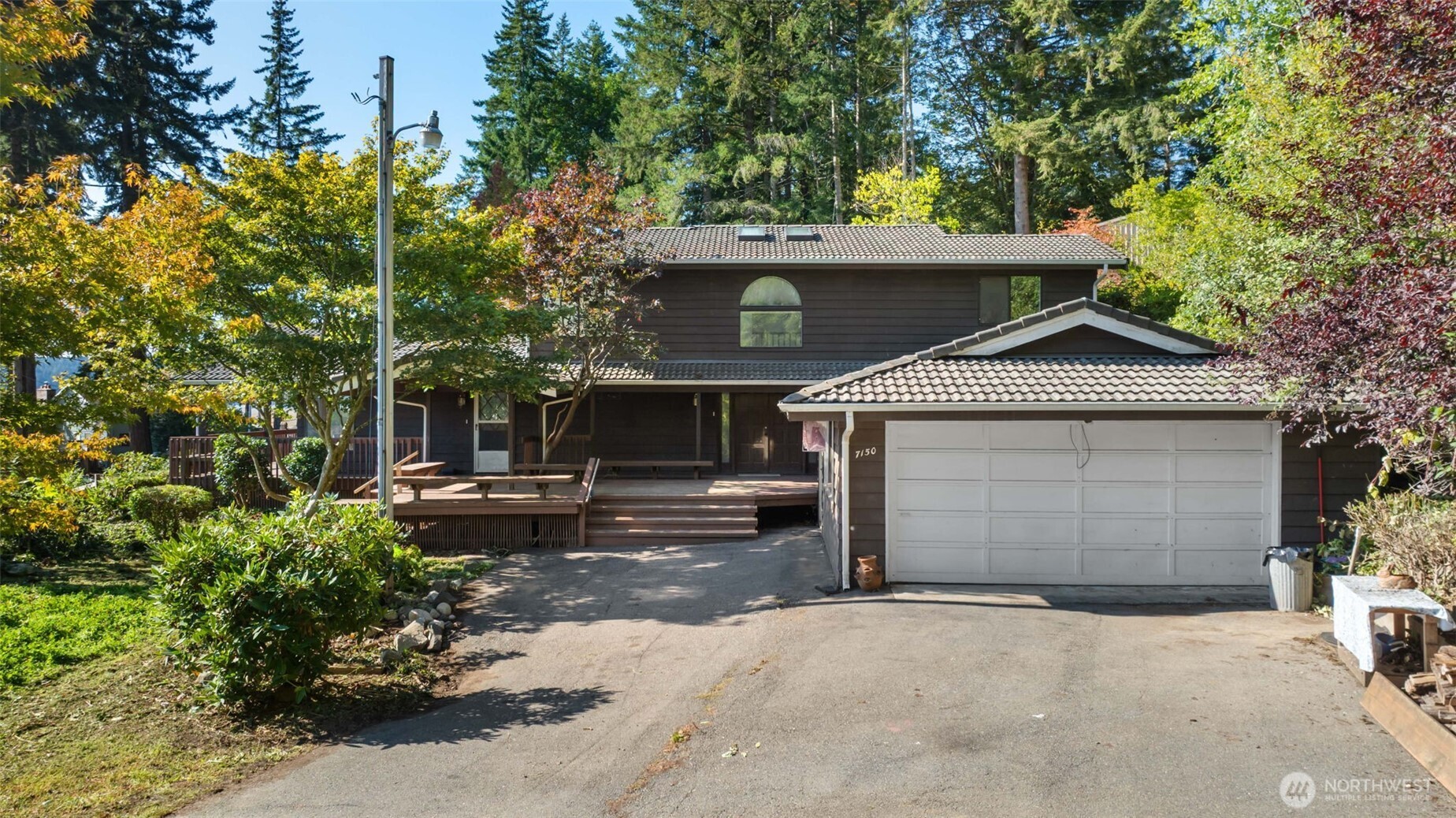 7150 Northeast North Shore Road Belfair, WA 98528 - Photo 5 of 32 a view of a house with a garage