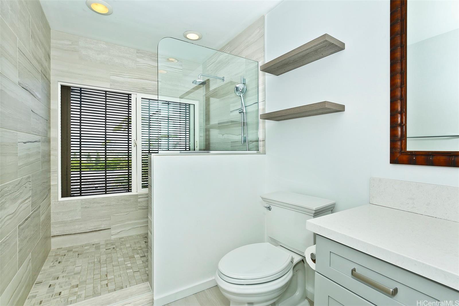 387 Kaelepulu Drive, Unit 1305 Kailua, HI 96734 - Photo 13 of 22 a bathroom with a toilet a sink and a shower