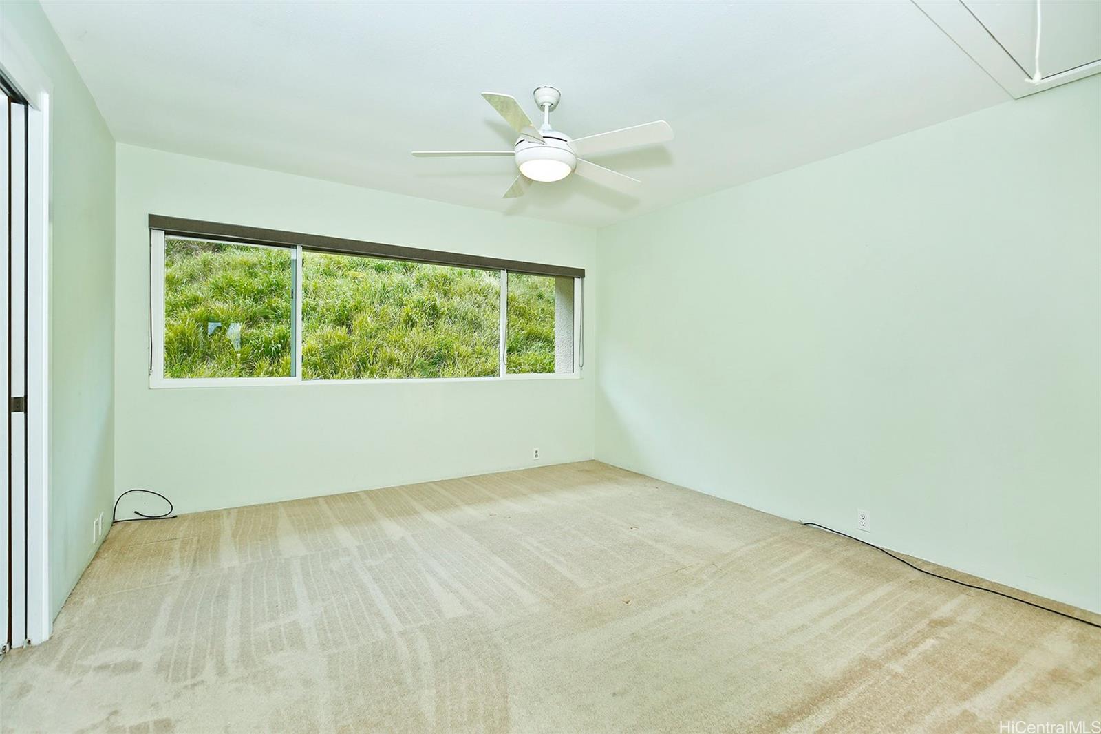 387 Kaelepulu Drive, Unit 1305 Kailua, HI 96734 - Photo 15 of 22 an empty room with a window