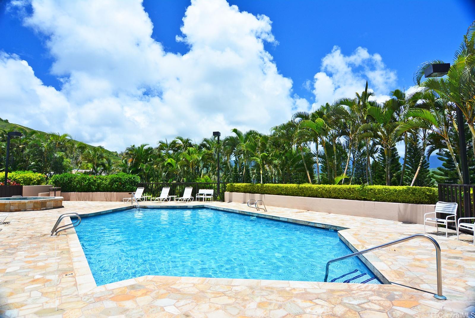 387 Kaelepulu Drive, Unit 1305 Kailua, HI 96734 - Photo 19 of 22 a view of a swimming pool with a yard