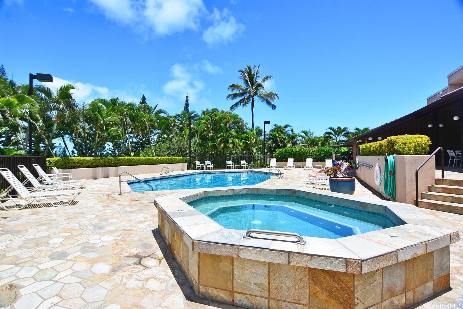 387 Kaelepulu Drive, Unit 1305 Kailua, HI 96734 - Photo 20 of 22 a view of swimming pool with chairs