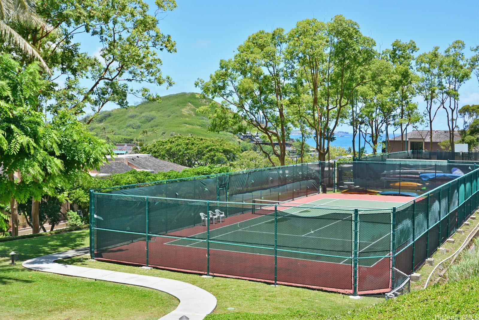 387 Kaelepulu Drive, Unit 1305 Kailua, HI 96734 - Photo 21 of 22 a view of a backyard with swimming pool
