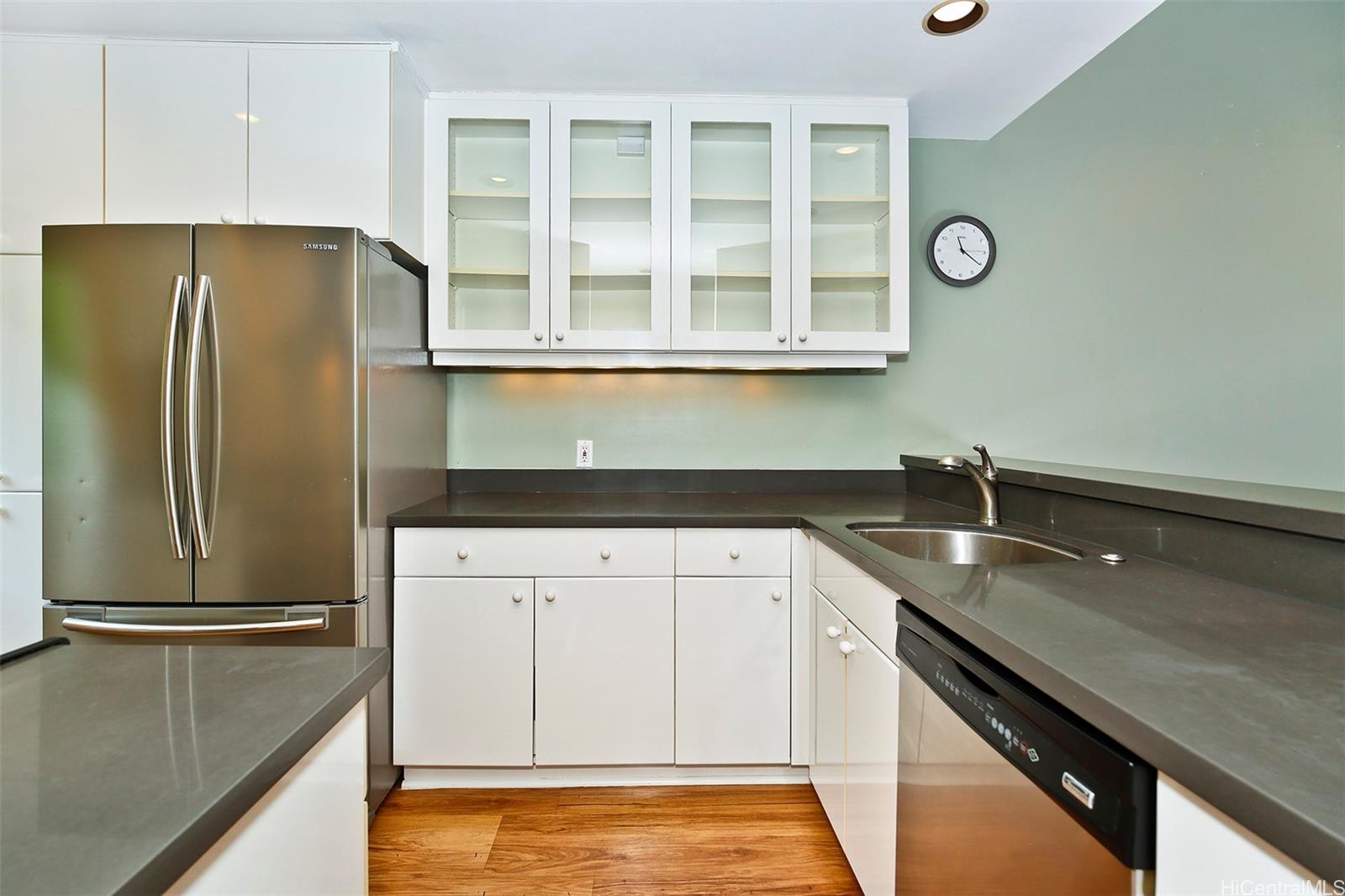 387 Kaelepulu Drive, Unit 1305 Kailua, HI 96734 - Photo 9 of 22 a kitchen with a refrigerator and a sink