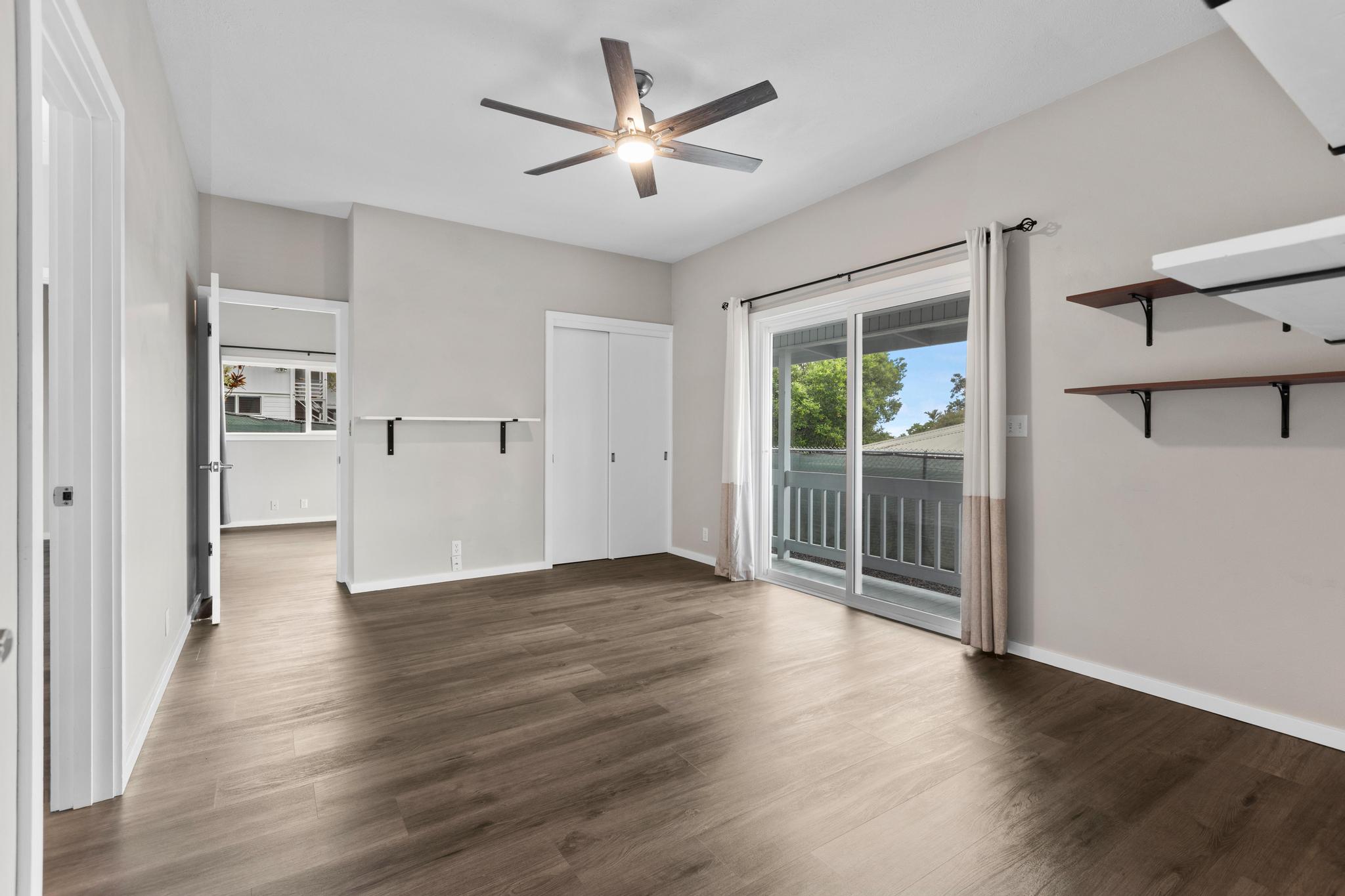 234 Kipa Street Hilo, HI 96720 - Photo 16 of 30 wooden floor in an empty room with a window