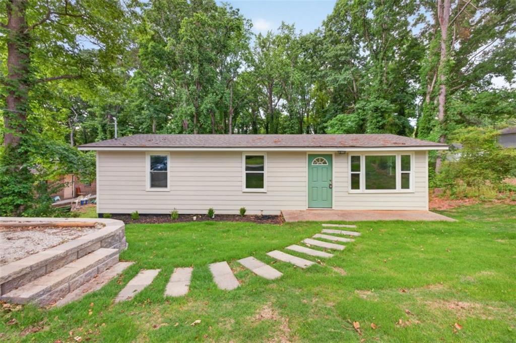 136 Nowell Street Monroe, GA 30655 - Photo 1 of 25 a front view of house with yard and green space