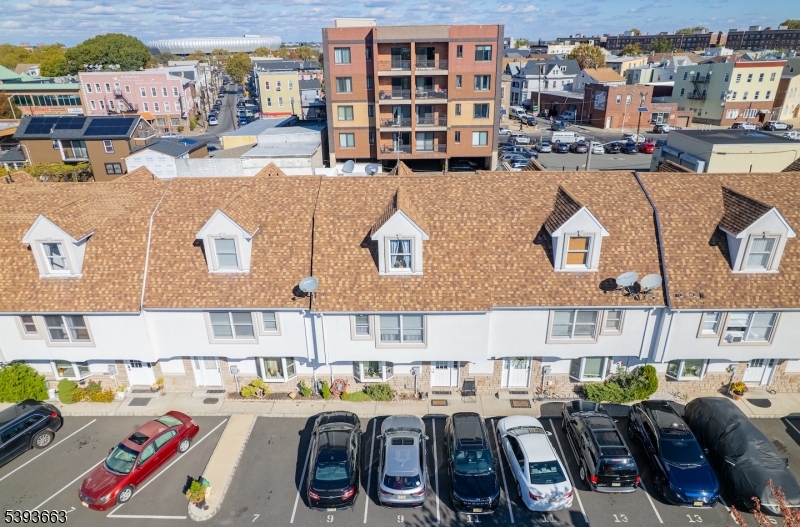 13 Valsumo Lane Newark, NJ 07105 - Photo 27 of 31 a buildings covered with tall buildings