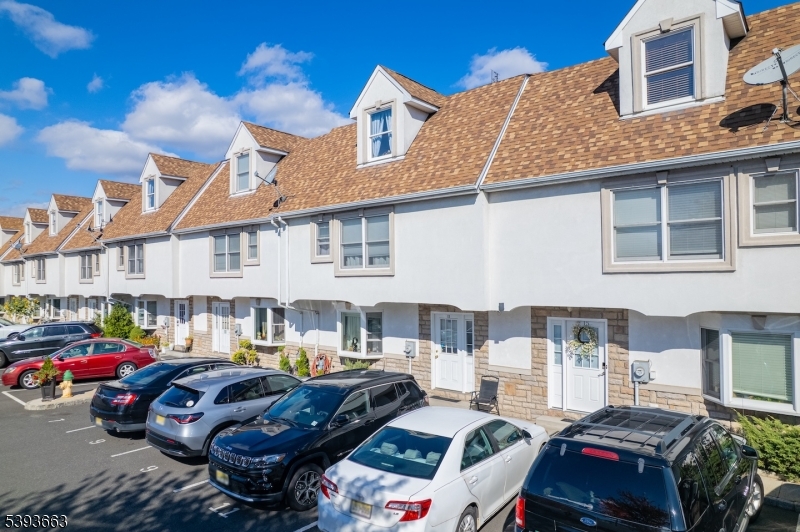 13 Valsumo Lane Newark, NJ 07105 - Photo 28 of 31 a front view of a house with cars parked