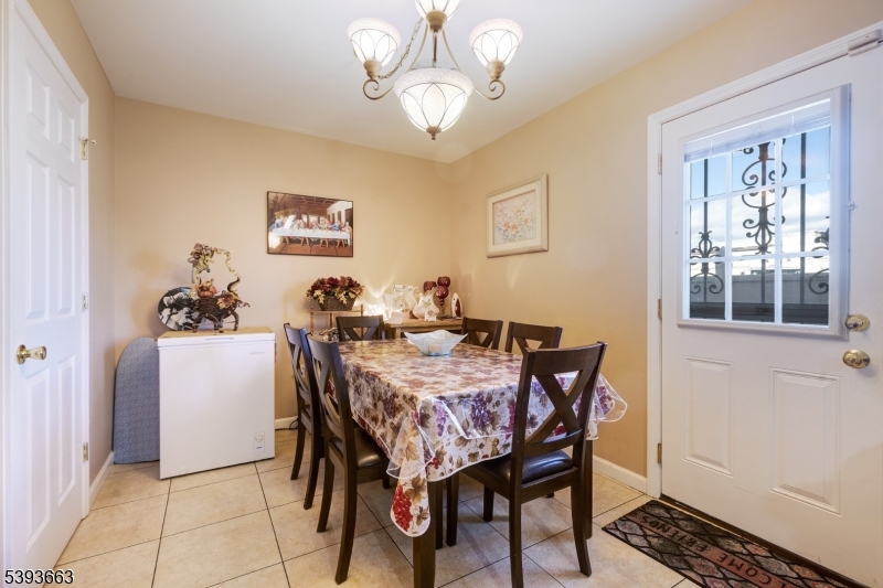 13 Valsumo Lane Newark, NJ 07105 - Photo 6 of 31 a view of a dining room with furniture and window