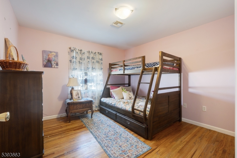 13 Valsumo Lane Newark, NJ 07105 - Photo 7 of 31 a bedroom with bunk bed
