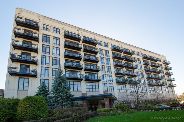 1524 South Sangamon Street, Unit 717S Chicago, IL 60608 - Photo 1 of 14 a view of front of building with yard