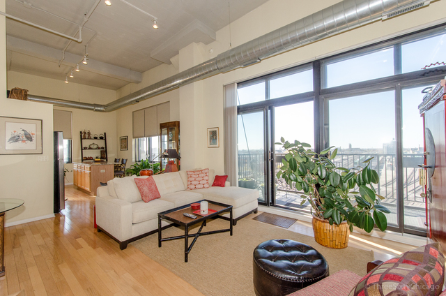 1524 South Sangamon Street, Unit 717S Chicago, IL 60608 - Photo 6 of 14 a living room with furniture and floor to ceiling windows