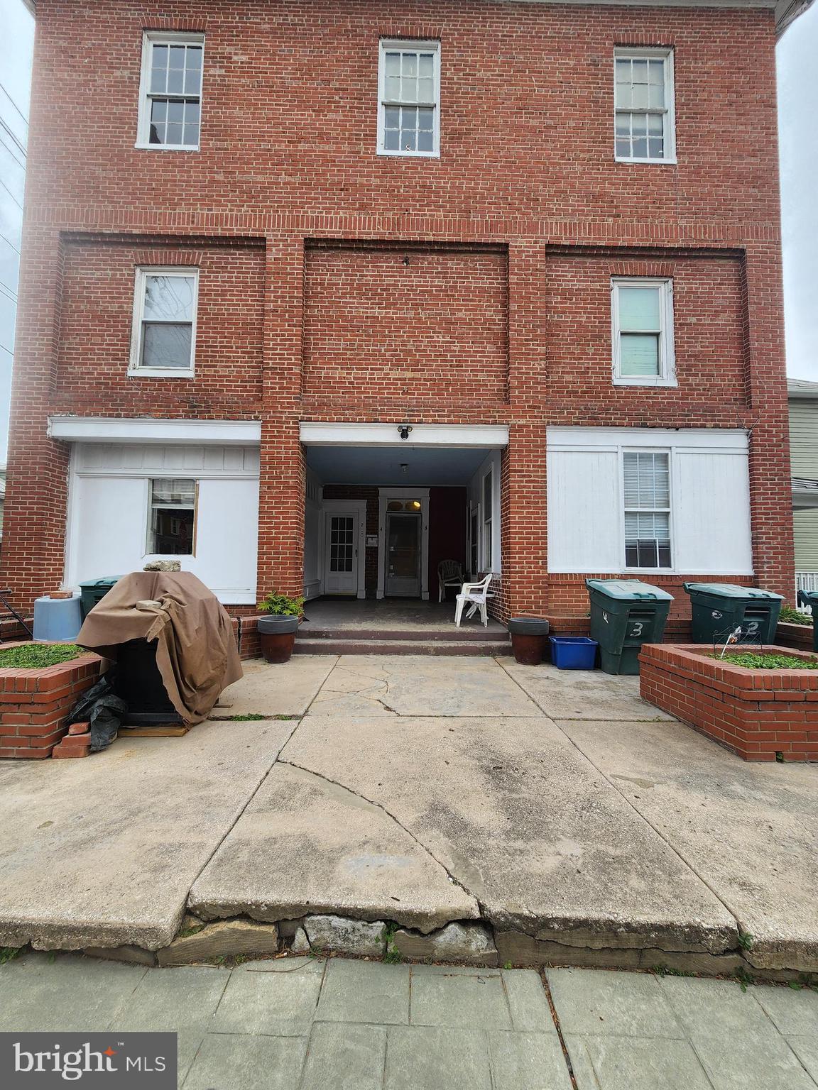 1 East Elger Street, Unit 2 Union Bridge, MD 21791 - Photo 1 of 16 a view of a brick house with many windows