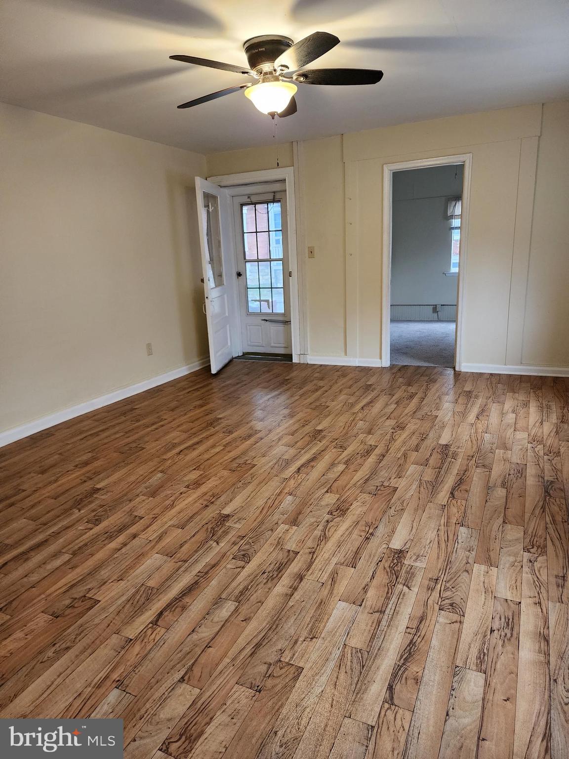 1 East Elger Street, Unit 2 Union Bridge, MD 21791 - Photo 4 of 16 a view of empty room with wooden floor and fan