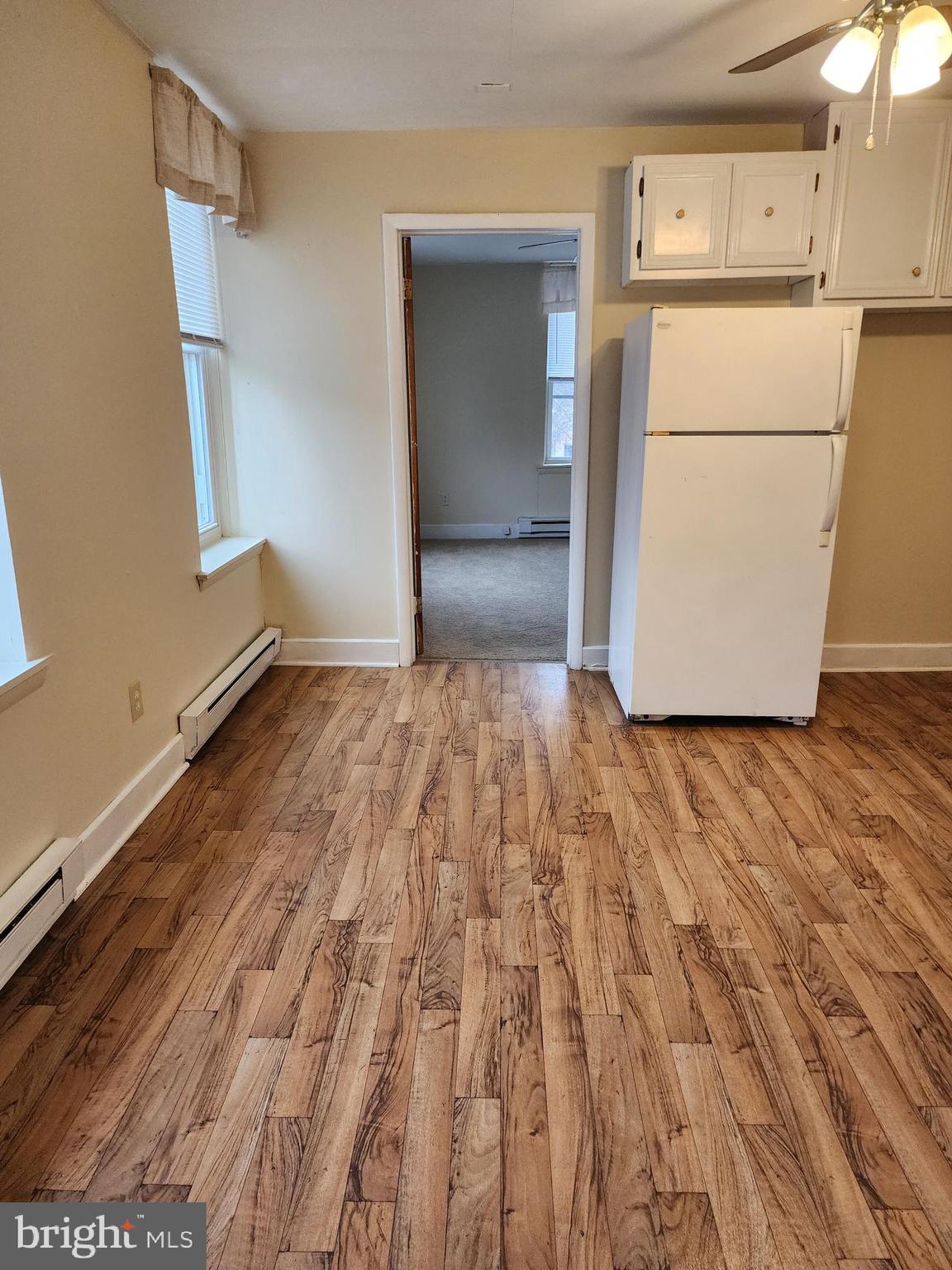 1 East Elger Street, Unit 2 Union Bridge, MD 21791 - Photo 10 of 16 a view of a refrigerator in kitchen and wooden floor