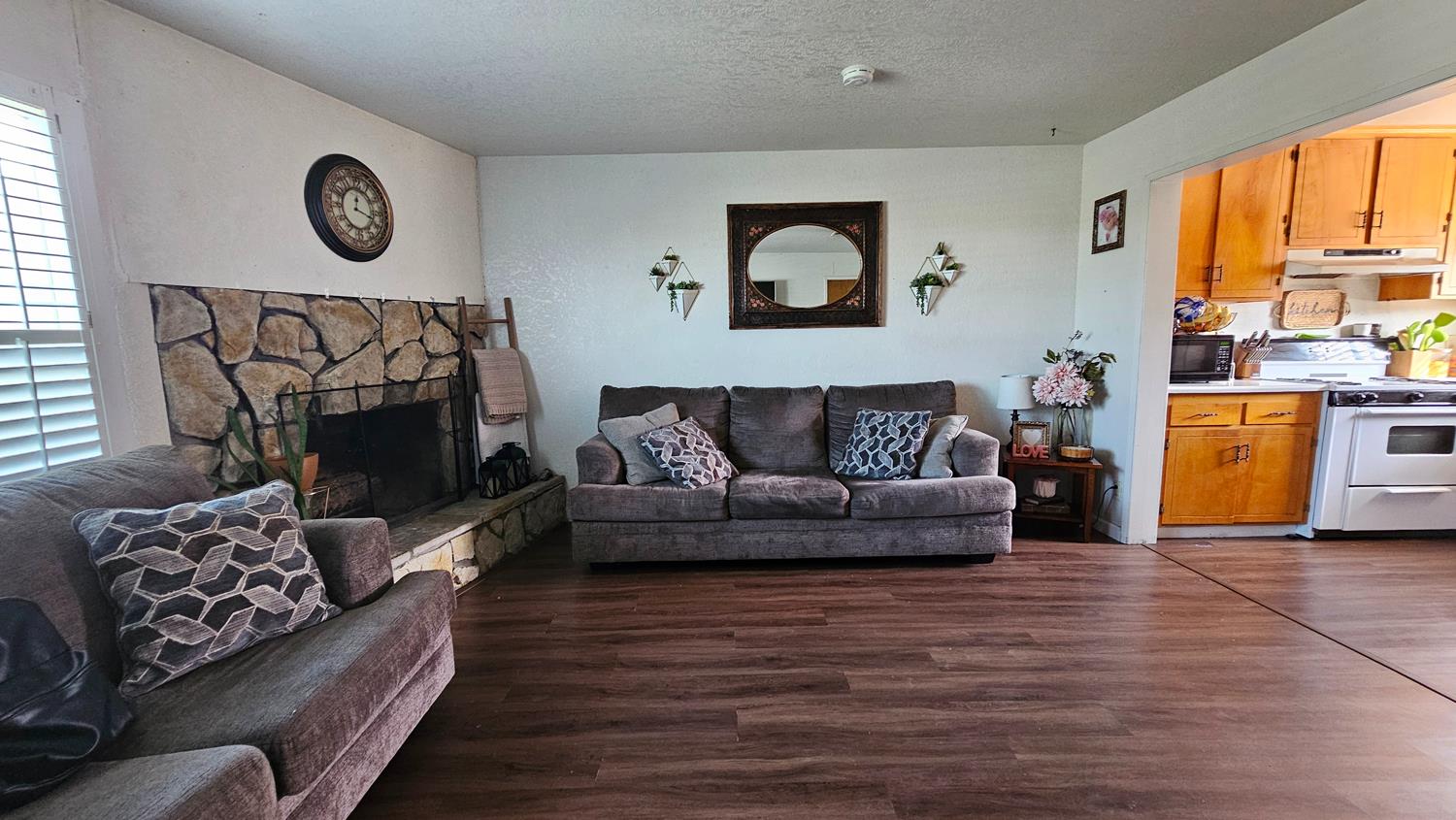 1526 8th Street Firebaugh, CA 93622 - Photo 12 of 57 a living room with furniture and a large window