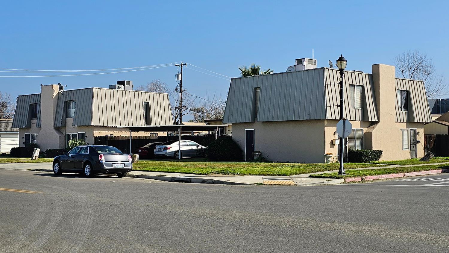 1526 8th Street Firebaugh, CA 93622 - Photo 4 of 57 a view of a street with cars on road