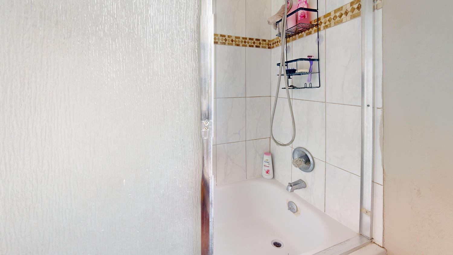 1526 8th Street Firebaugh, CA 93622 - Photo 45 of 57 a bathroom with a shower