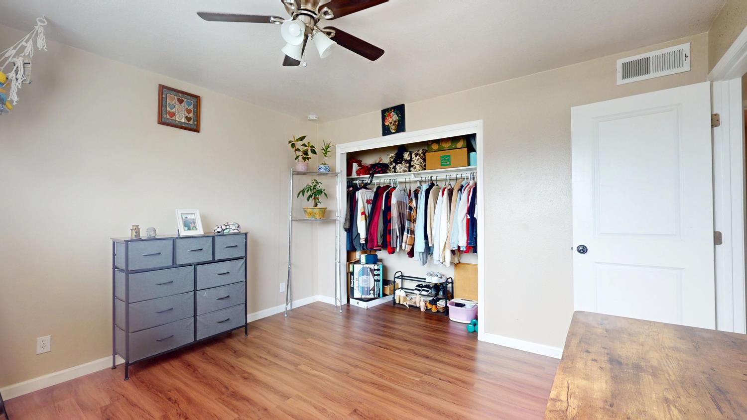 1526 8th Street Firebaugh, CA 93622 - Photo 51 of 57 a view of a livingroom with wooden floor and furniture