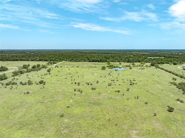 a view of beach with an ocean
