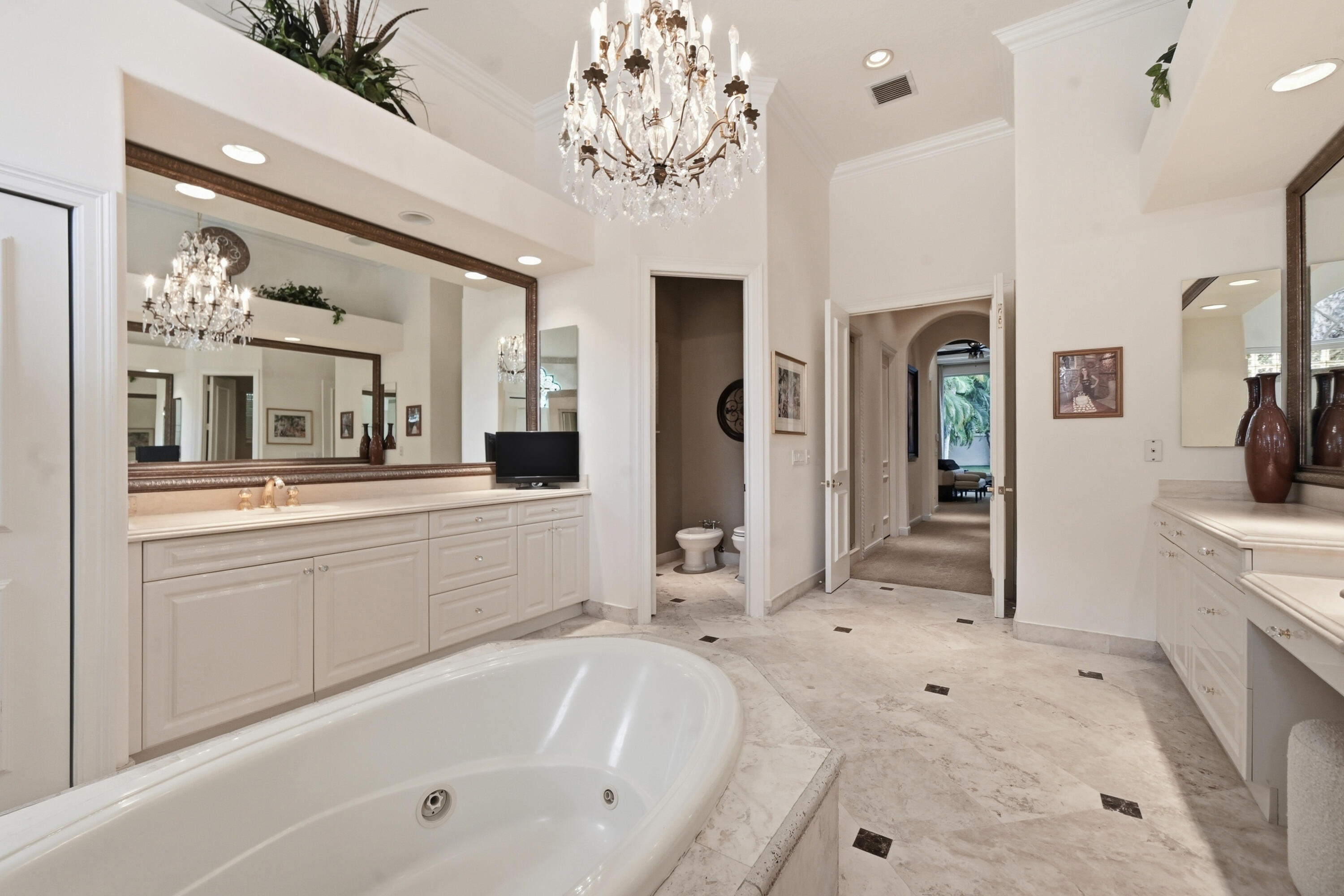 2425 Northwest 49th Lane Boca Raton, FL 33431 - Photo 14 of 46 a bathroom with a tub sink and mirror