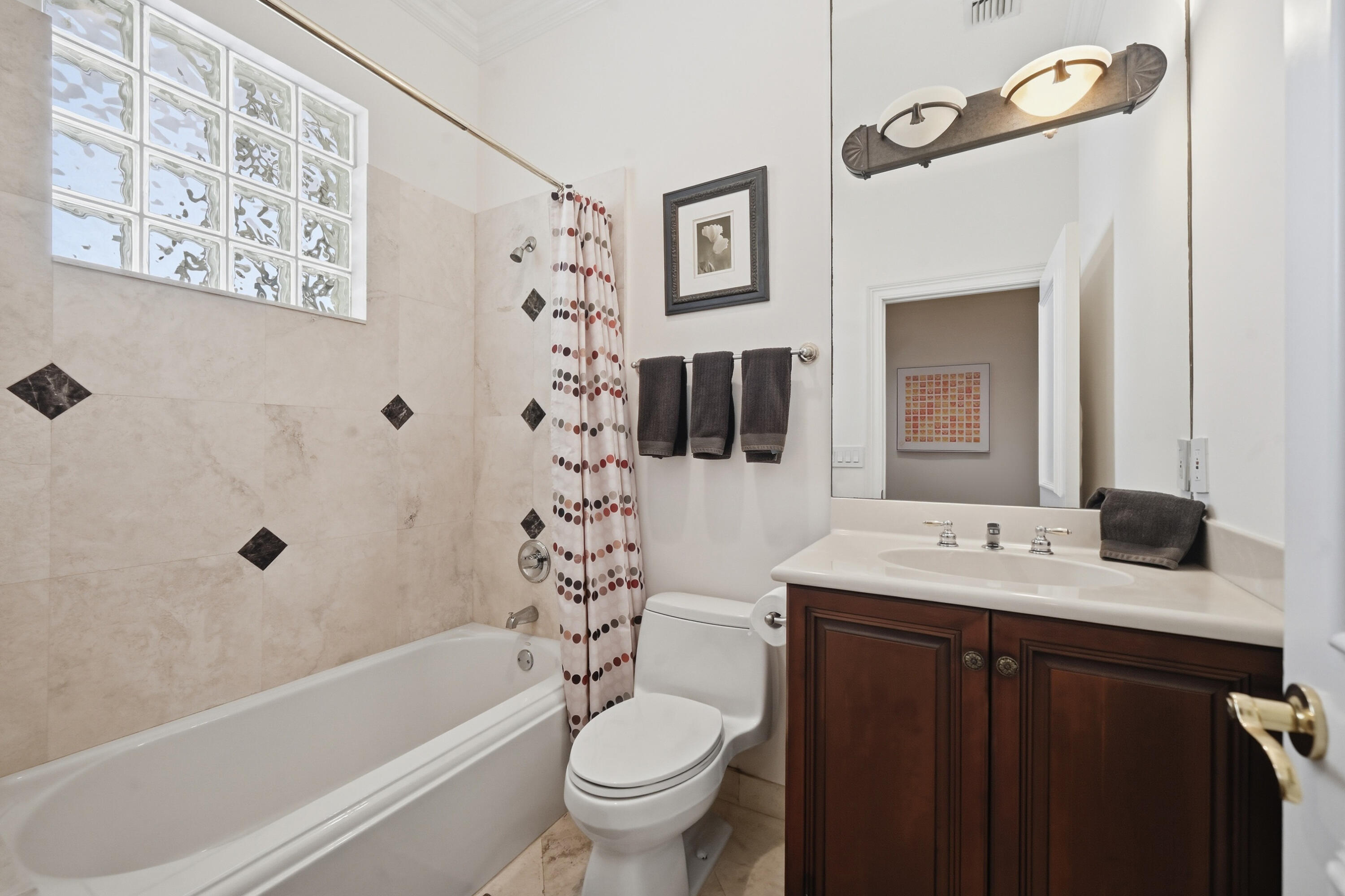 2425 Northwest 49th Lane Boca Raton, FL 33431 - Photo 27 of 46 a bathroom with a sink a toilet and a bathtub