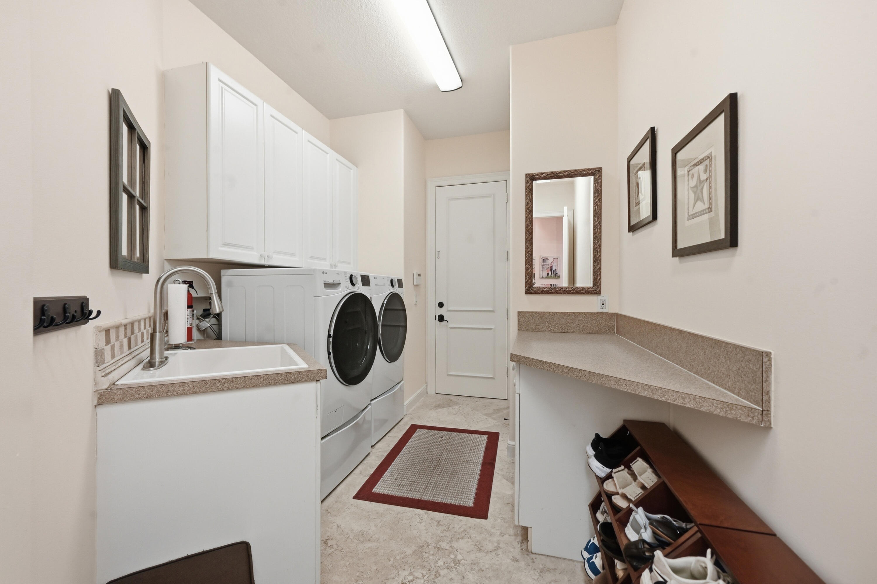 2425 Northwest 49th Lane Boca Raton, FL 33431 - Photo 28 of 46 a utility room with sink dryer and washer