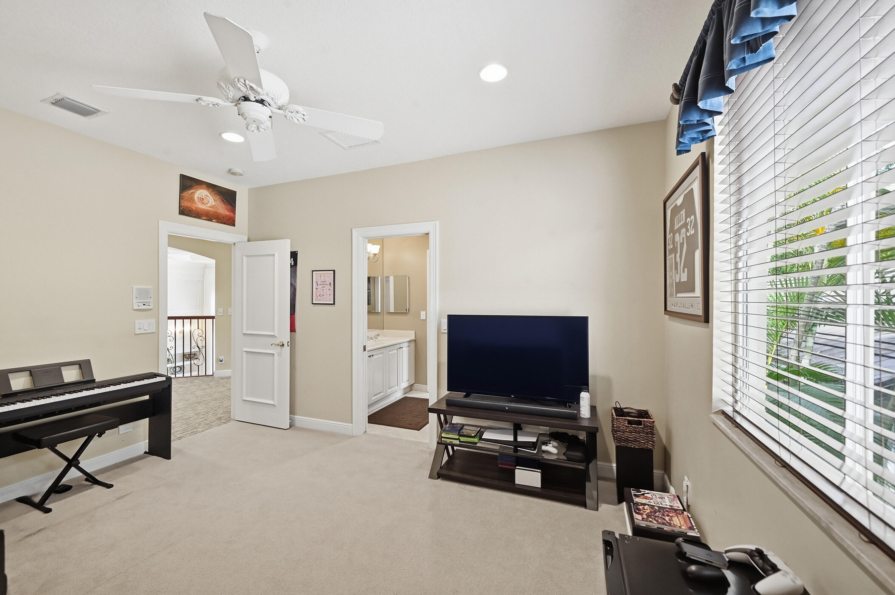 2425 Northwest 49th Lane Boca Raton, FL 33431 - Photo 35 of 46 a living room with furniture and a flat screen tv