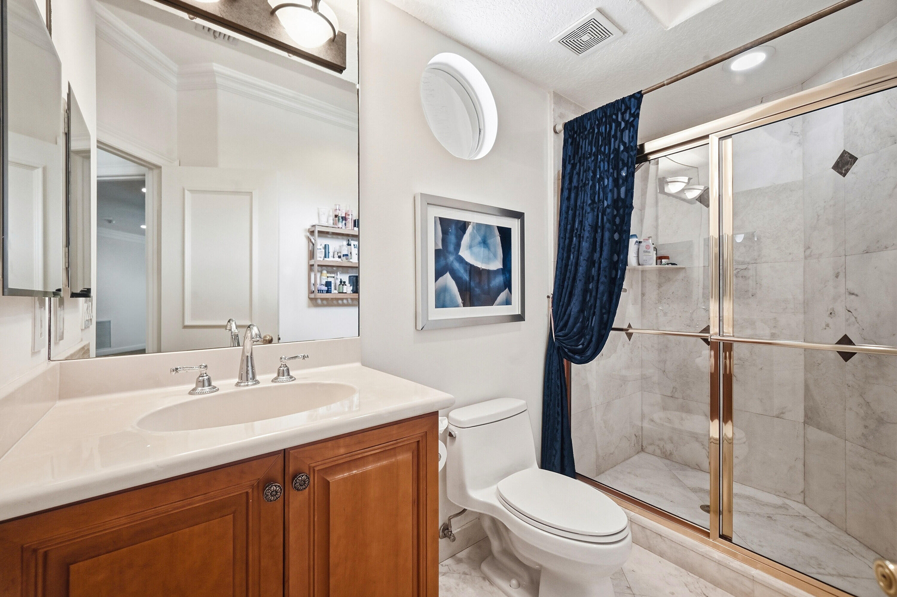 2425 Northwest 49th Lane Boca Raton, FL 33431 - Photo 37 of 46 a bathroom with a sink a toilet and shower