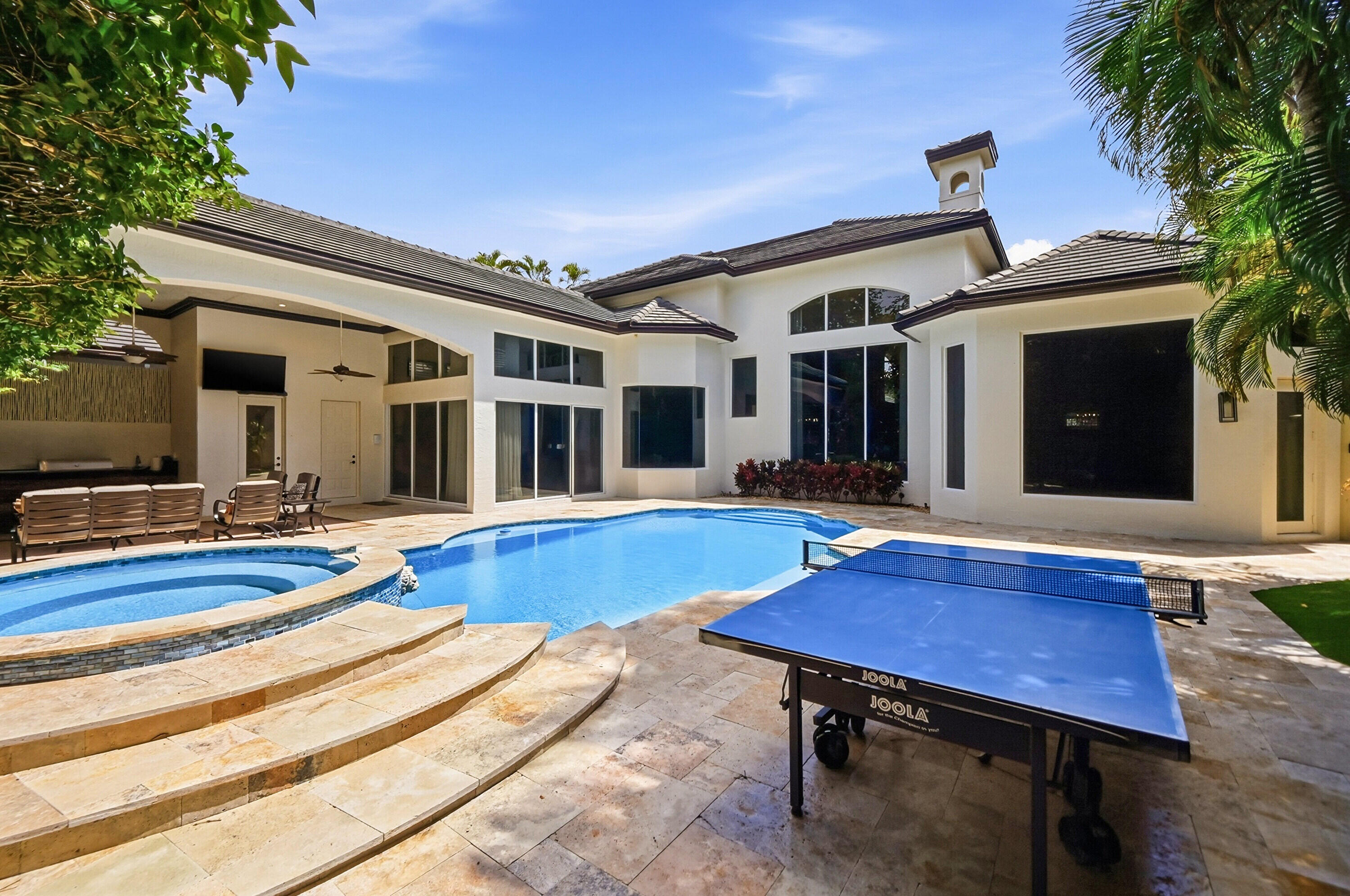 2425 Northwest 49th Lane Boca Raton, FL 33431 - Photo 38 of 46 a view of a house with swimming pool and porch with furniture