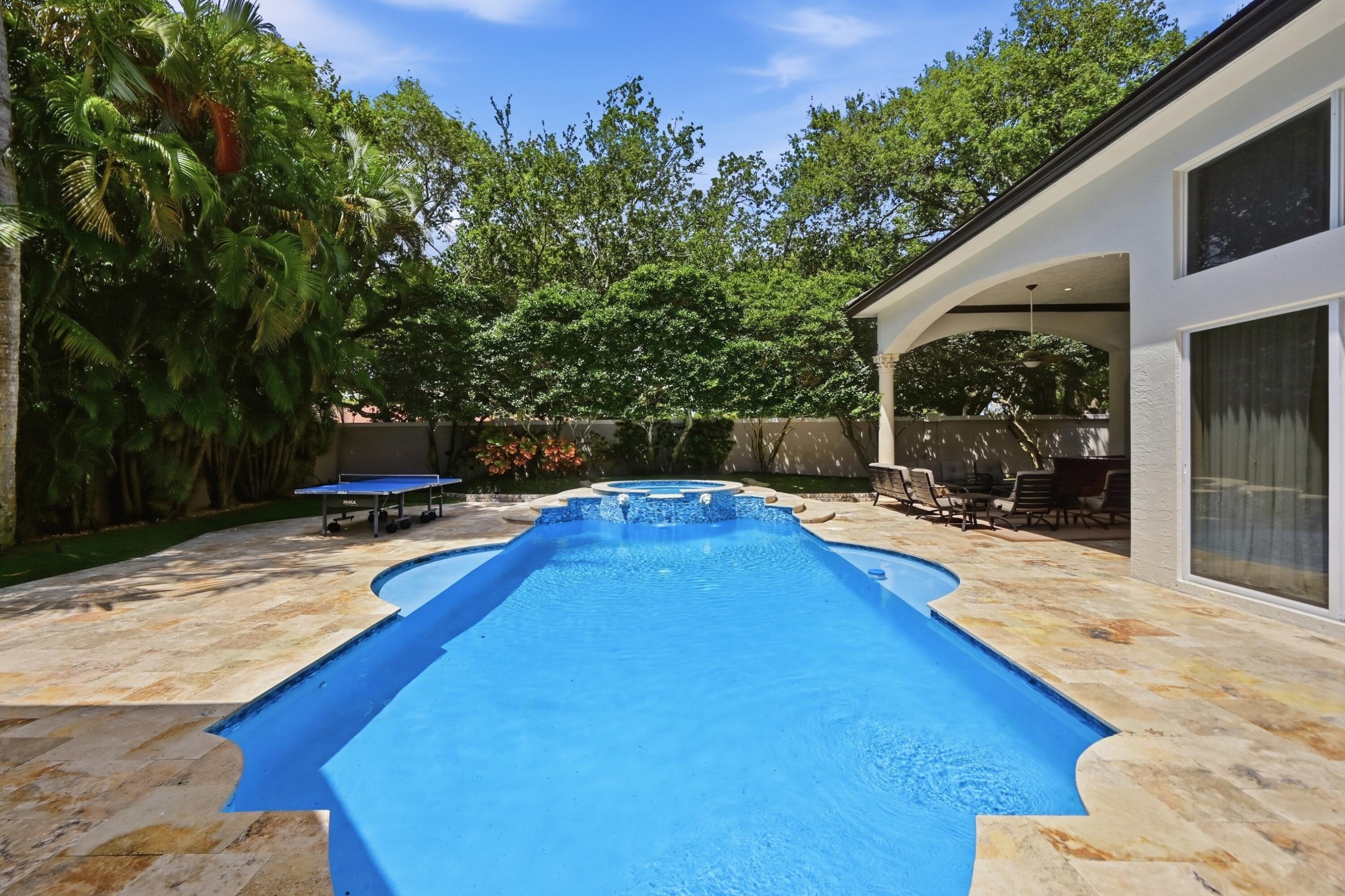 2425 Northwest 49th Lane Boca Raton, FL 33431 - Photo 40 of 46 a swimming pool with outdoor seating and yard