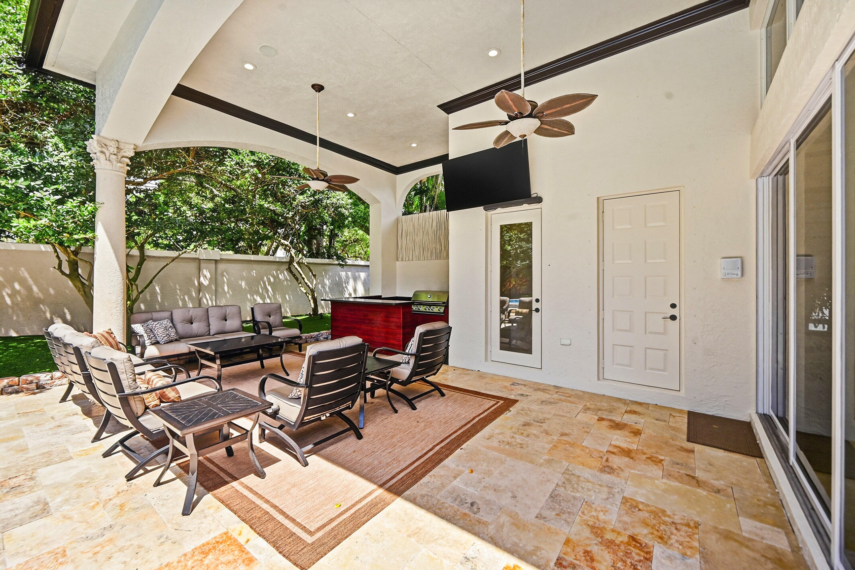 2425 Northwest 49th Lane Boca Raton, FL 33431 - Photo 43 of 46 a view of a patio with table and chairs
