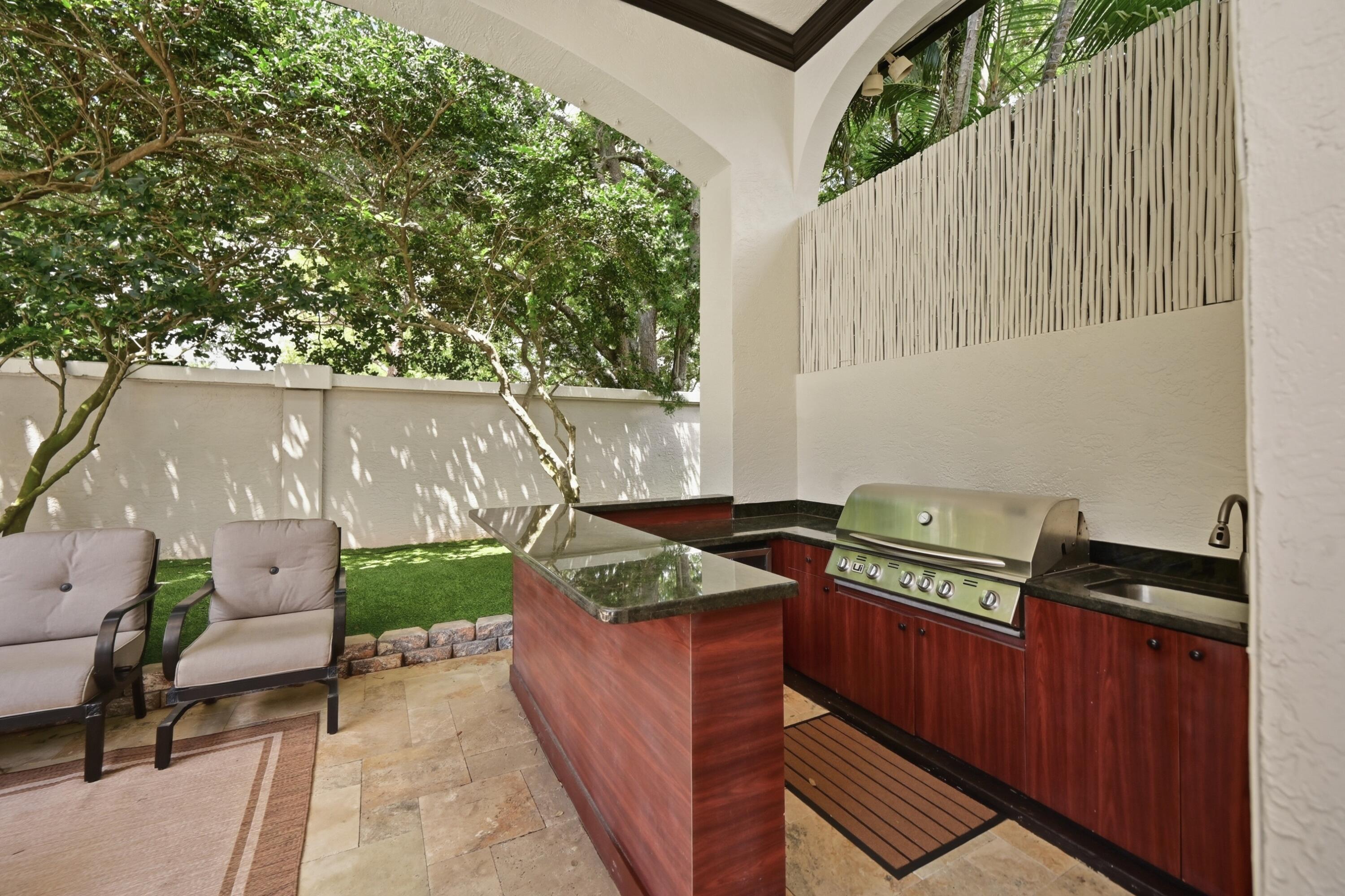 2425 Northwest 49th Lane Boca Raton, FL 33431 - Photo 44 of 46 a view of a backyard with chairs