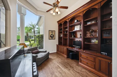 a kitchen with stainless steel appliances granite countertop a refrigerator a stove and a sink