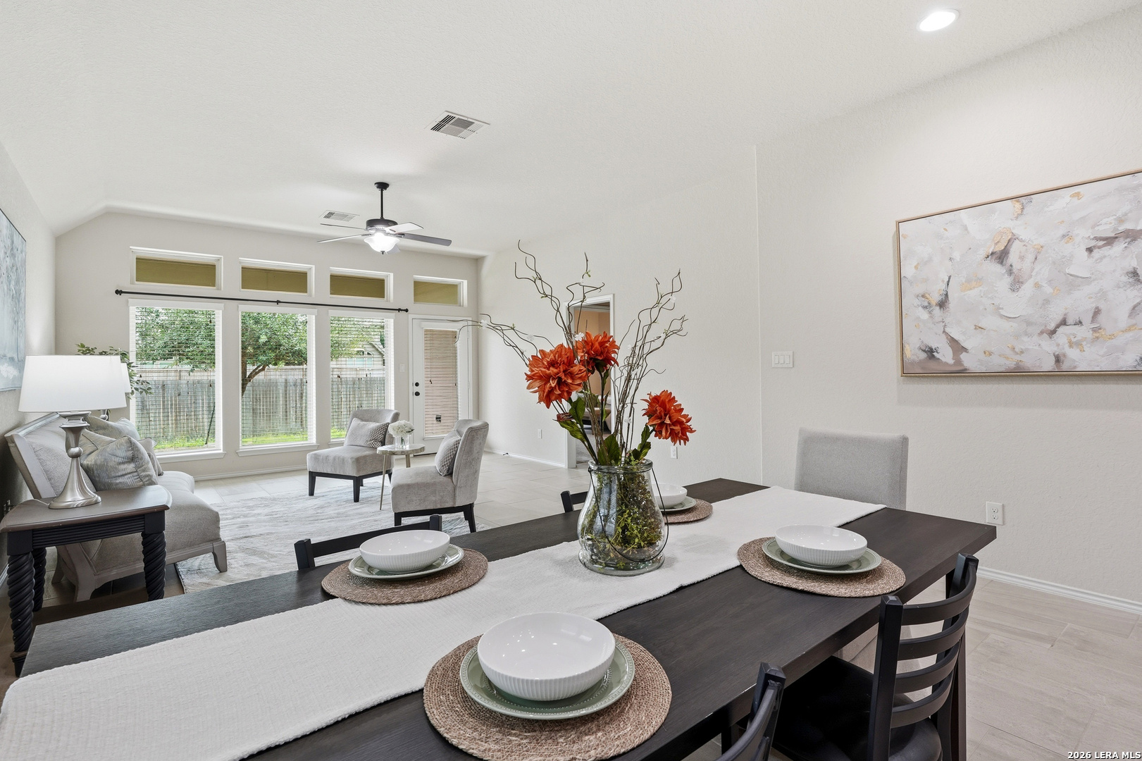 2129 Range Road Seguin, TX 78155 - Photo 29 of 41 a dining room with furniture a potted plant and a fireplace
