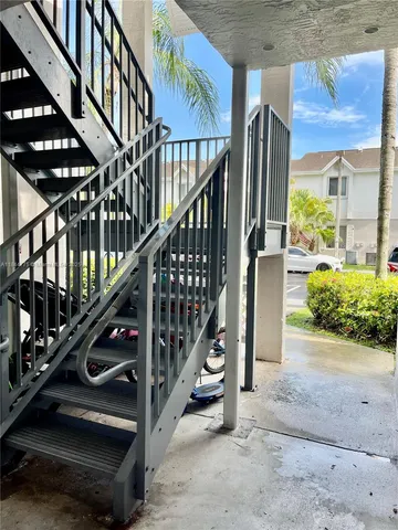 a view of a livingroom with an empty space and a window