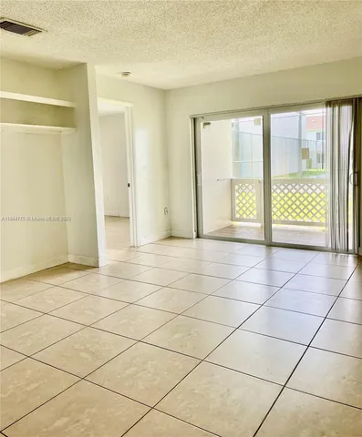 a view of room with walk in closet and window