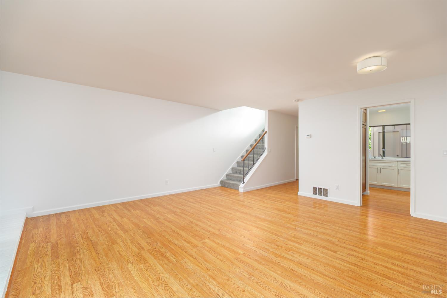 19 Burdell Court Novato, CA 94949 - Photo 11 of 27 a view of an empty room with wooden floor
