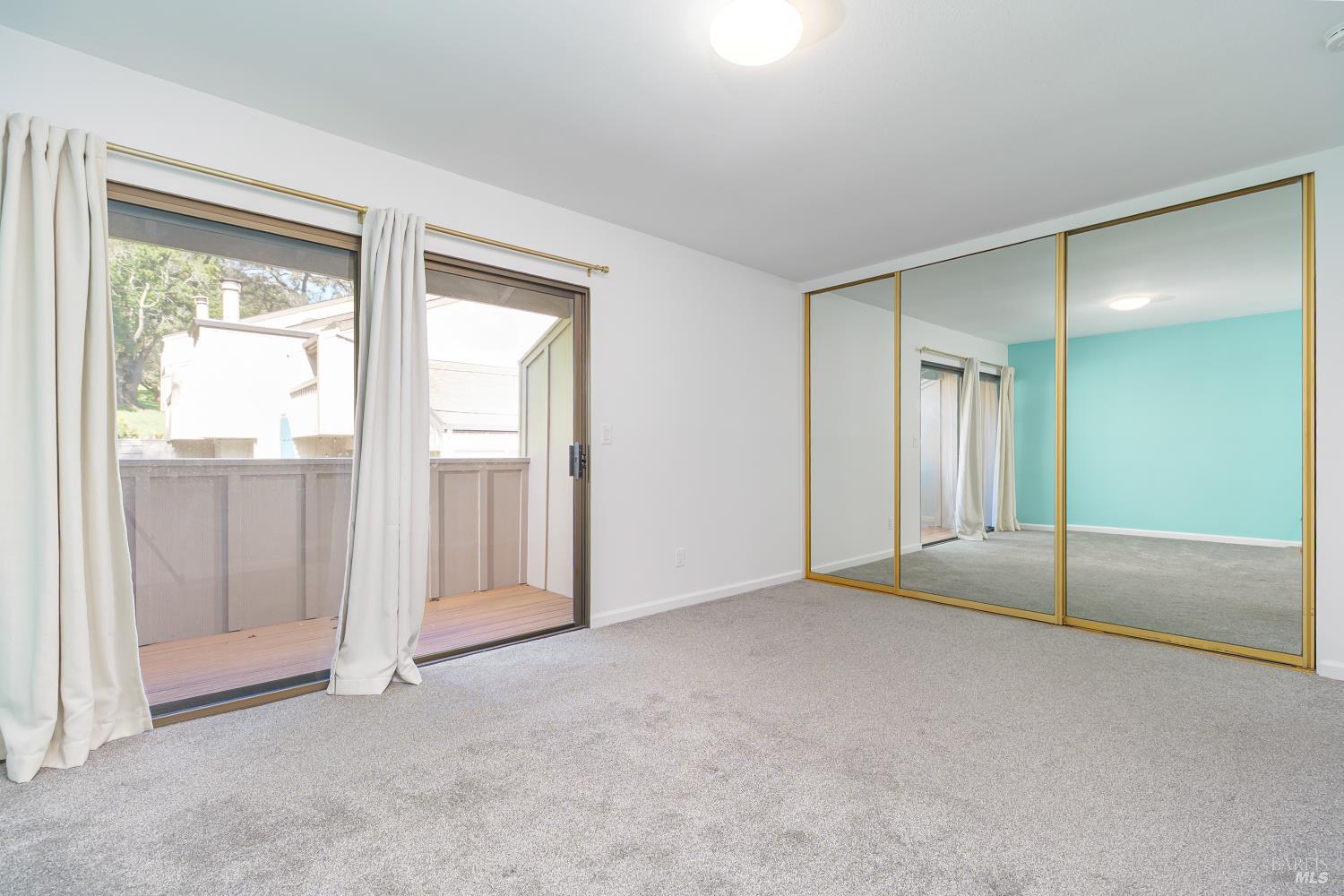 19 Burdell Court Novato, CA 94949 - Photo 14 of 27 an empty room with sliding glass door and shower