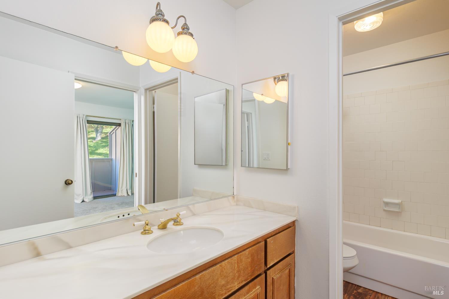 19 Burdell Court Novato, CA 94949 - Photo 18 of 27 a bathroom with a sink and a mirror