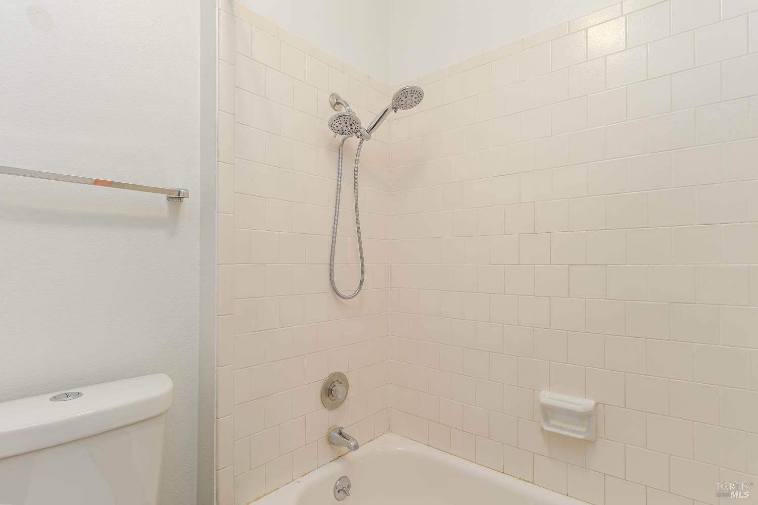 19 Burdell Court Novato, CA 94949 - Photo 19 of 27 a bathroom with a shower and a toilet