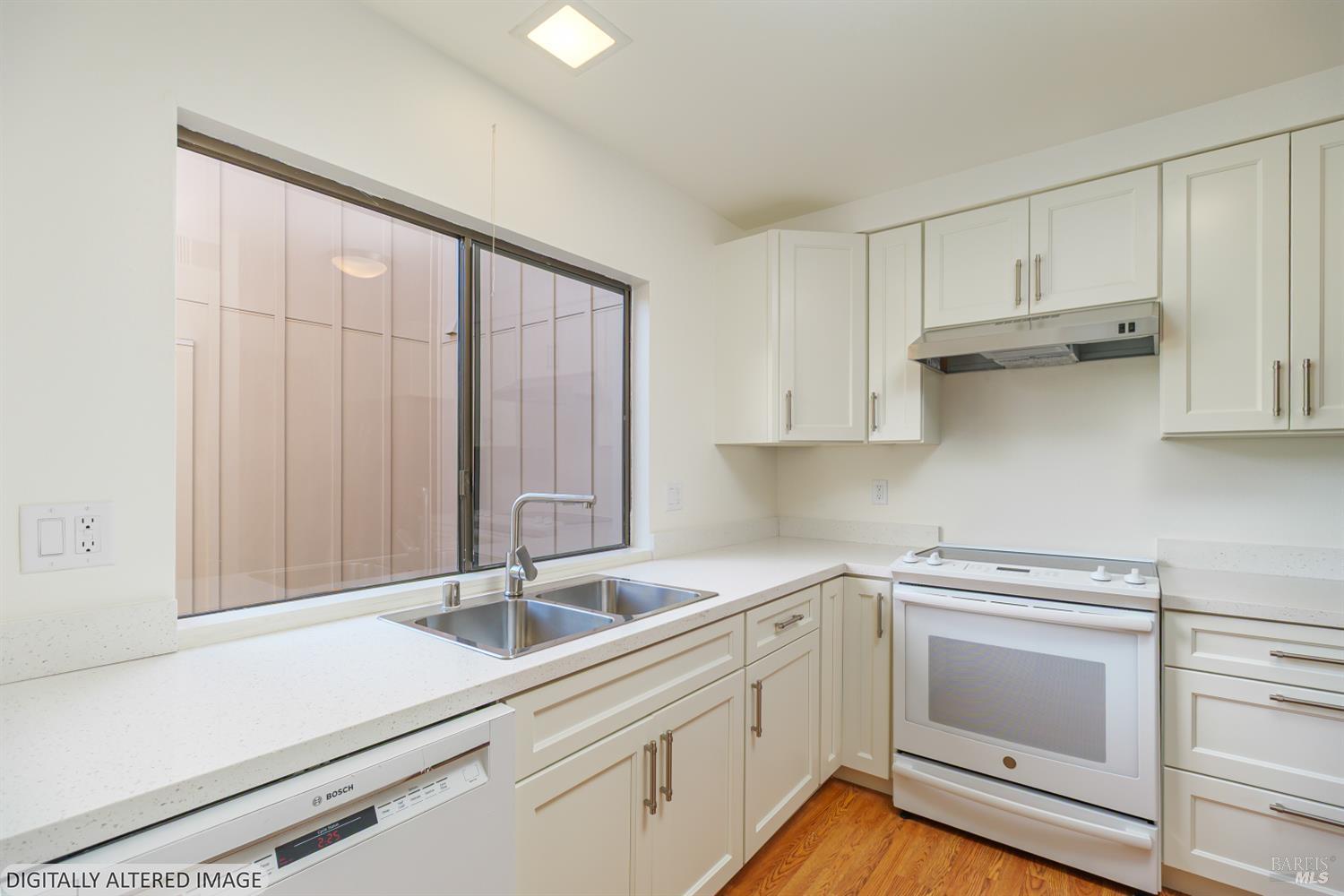 19 Burdell Court Novato, CA 94949 - Photo 5 of 27 a kitchen with a sink cabinets and stainless steel appliances