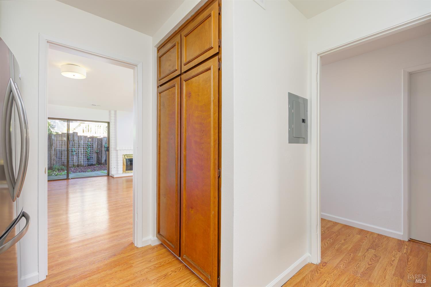 19 Burdell Court Novato, CA 94949 - Photo 8 of 27 a view of a hallway with wooden floor and glass door