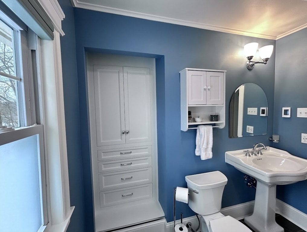 17 Longfellow Road Worcester, MA 01602 - Photo 18 of 19 a bathroom with a sink a toilet and mirror