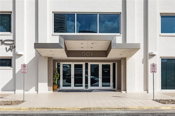 a view of a brick house with a outdoor space