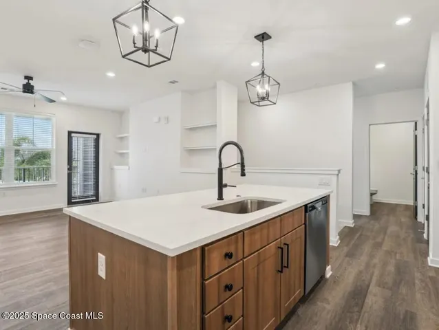 a kitchen with a sink and dishwasher