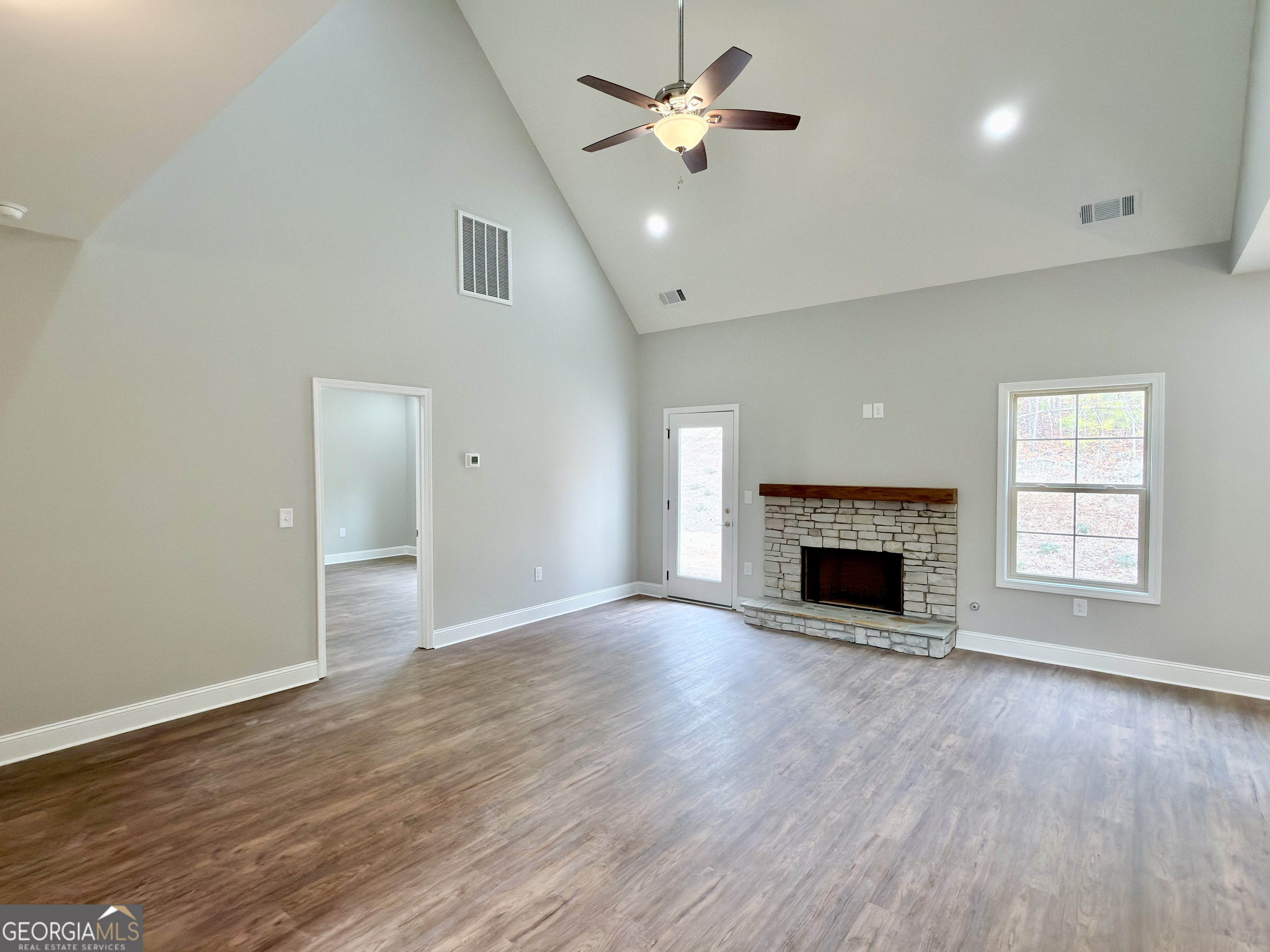 8 Bush Arbor Place Rome, GA 30165 - Photo 15 of 42 a view of an empty room with a fireplace and a window