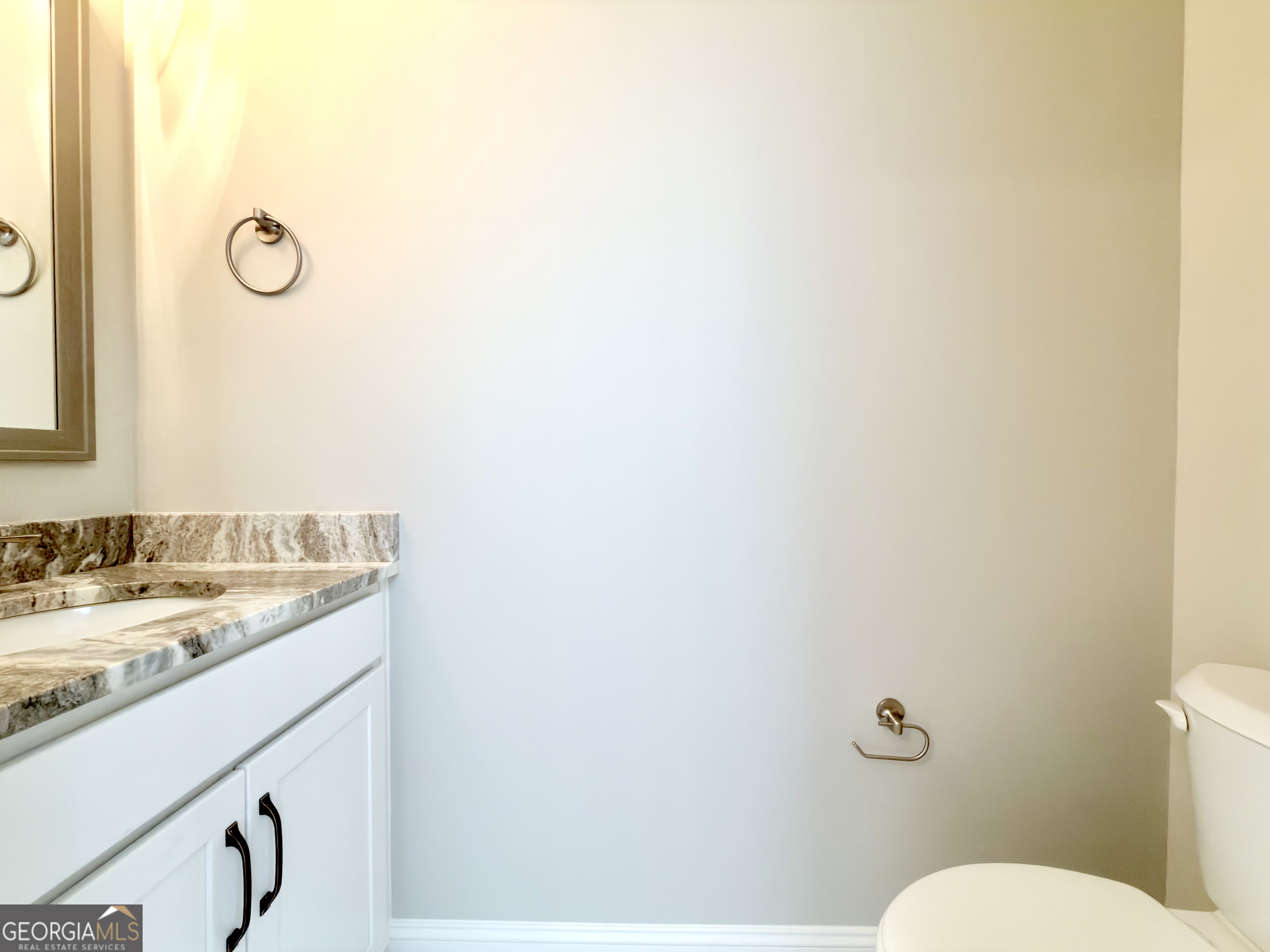 8 Bush Arbor Place Rome, GA 30165 - Photo 29 of 42 a bathroom with a granite countertop sink and a mirror
