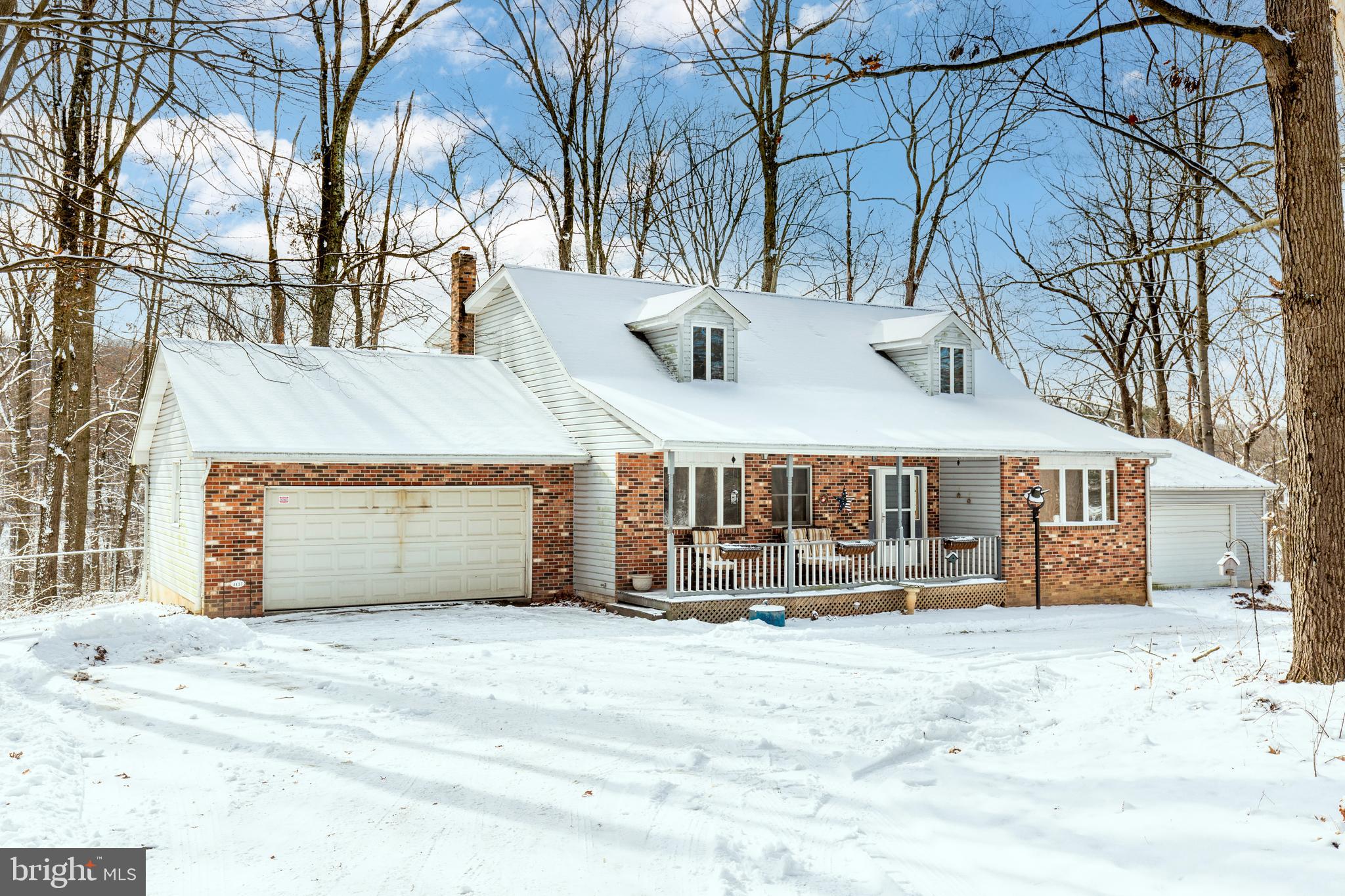 4437 Dave Rill Road Hampstead, MD 21074 - Photo 1 of 68 a view of a house with a yard covered in snow