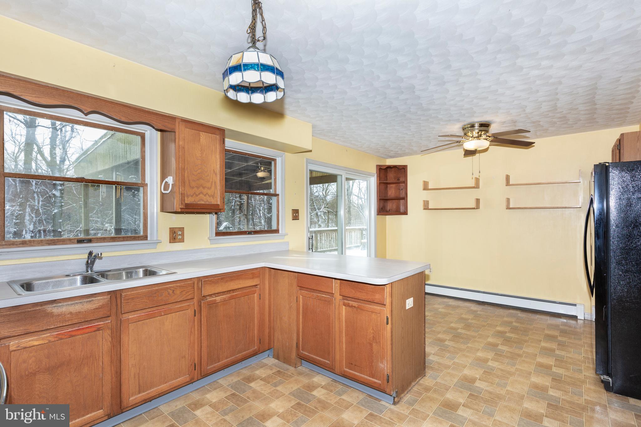 4437 Dave Rill Road Hampstead, MD 21074 - Photo 13 of 68 a kitchen with stainless steel appliances granite countertop a refrigerator and a sink